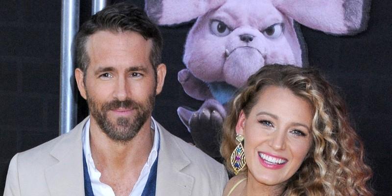 Ryan Reynolds Wearing a Suit With Blake Lively In a Yellow dress On a Red Carpet
